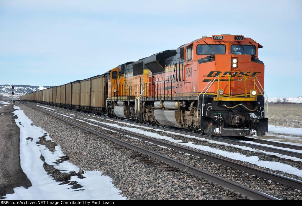 Loaded coal train rolls east